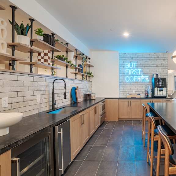 coffee bar with subway tile and wood shelving at the yancey apartments, charlotte