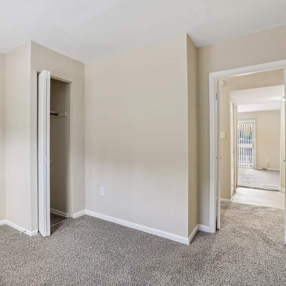 a room with a carpeted floor and white walls.