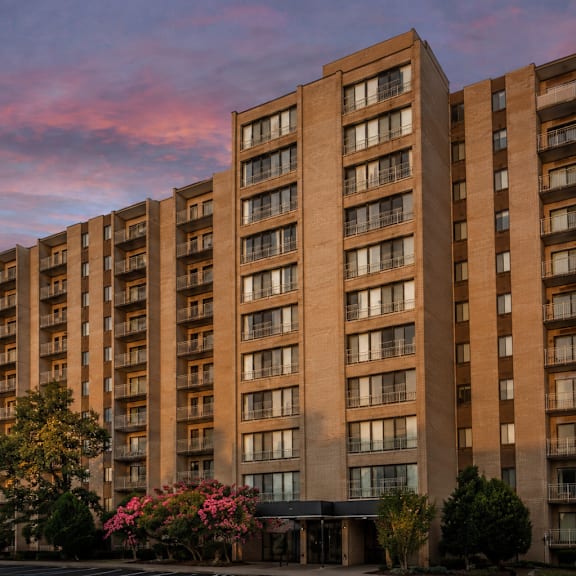 a large apartment building with balconies and windows is shown.