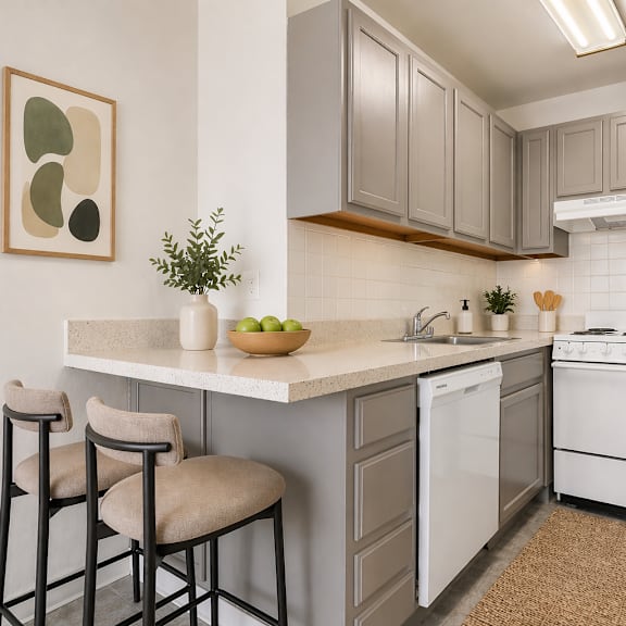 a kitchen with white appliances and a white refrigerator.