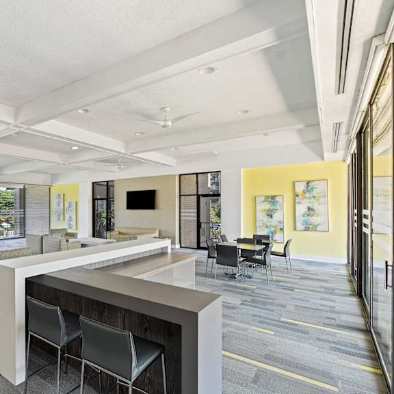 a modern office space with a long table and chairs.