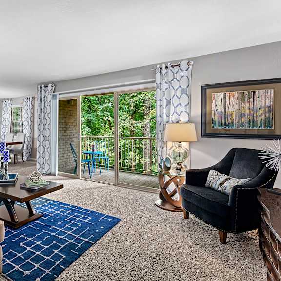 living room with balcony at versailles apartments, towson