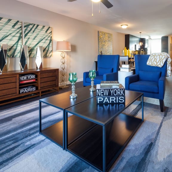 Thumbnail 5 of 9 a living room with a coffee table with a parks sign on it at Ansley at Town Center, Evans, Georgia