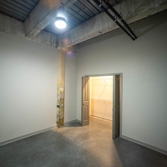 a small room with a door in the corner and a spotlight on the ceiling at conwood flats, memphis, tn