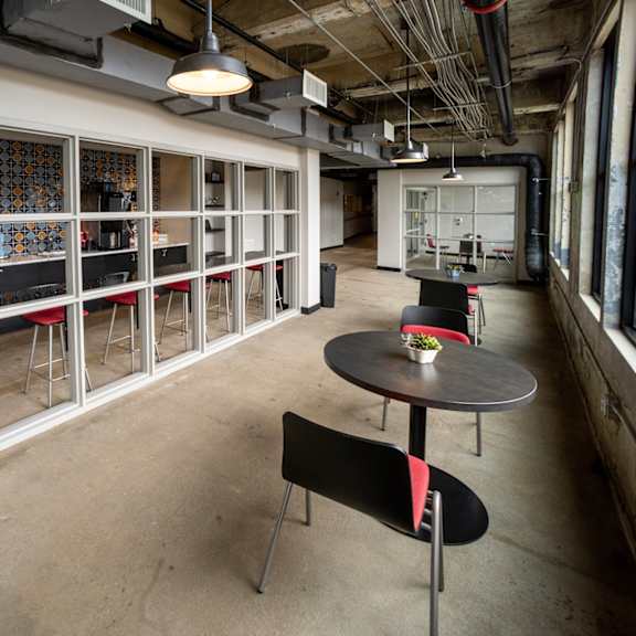 a room with tables and stools in front of a window at conwood flats, memphis, tennessee