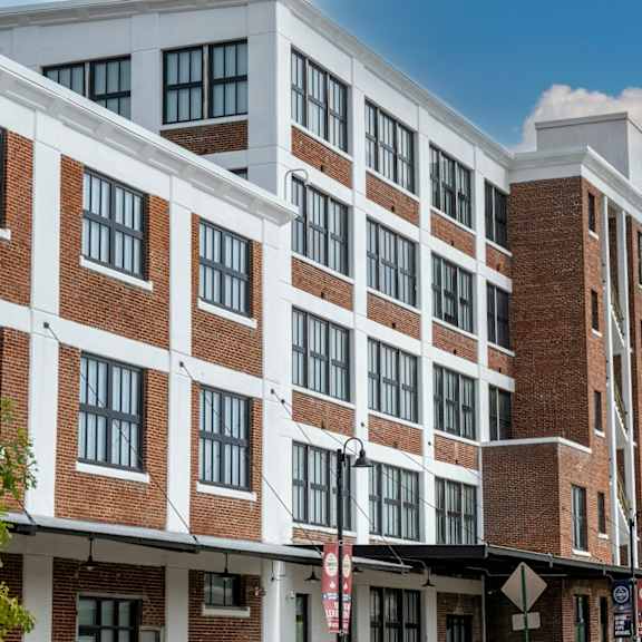 a large brick and white building with many windows at conwood flats, memphis