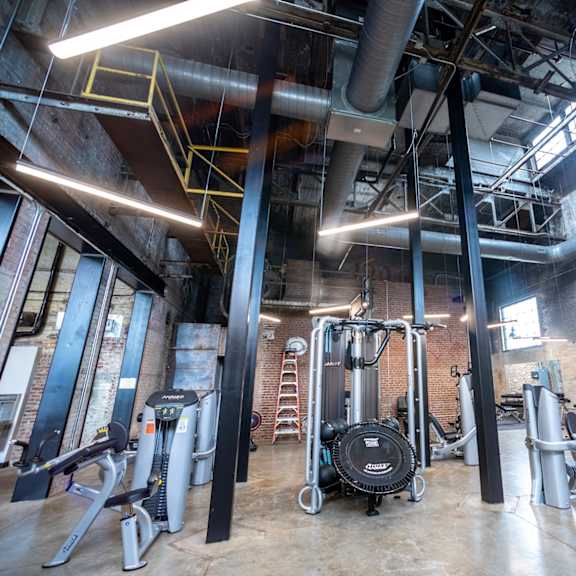 a gym with a lot of exercise equipment at conwood flats, memphis, tn, 38107