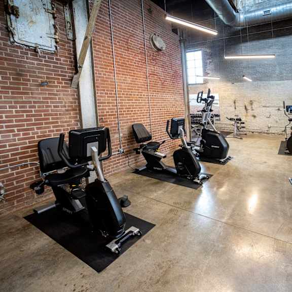a fitness center with treadmills and elliptical machines at conwood flats, memphis