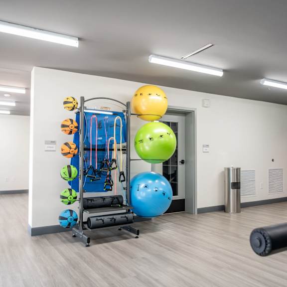 a gym with a variety of equipment including a treadmill, a stationary bike, and a rowing machine at harbor side at conwood flats apartments, memphis, tennessee