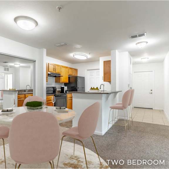 a modern kitchen with a dining table and chairs.