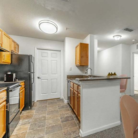 a kitchen with an island and a dining table