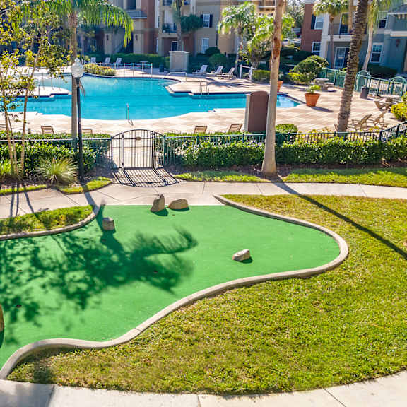 resort style pool and putting green