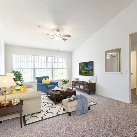 a living room with white walls and carpet