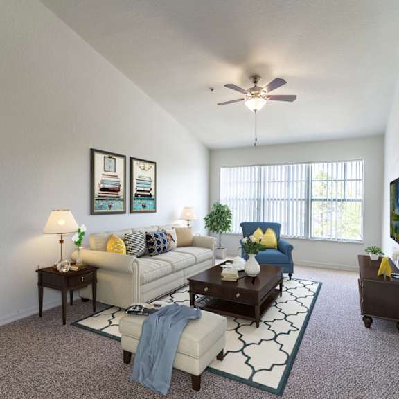 a living room with a ceiling fan and a large window