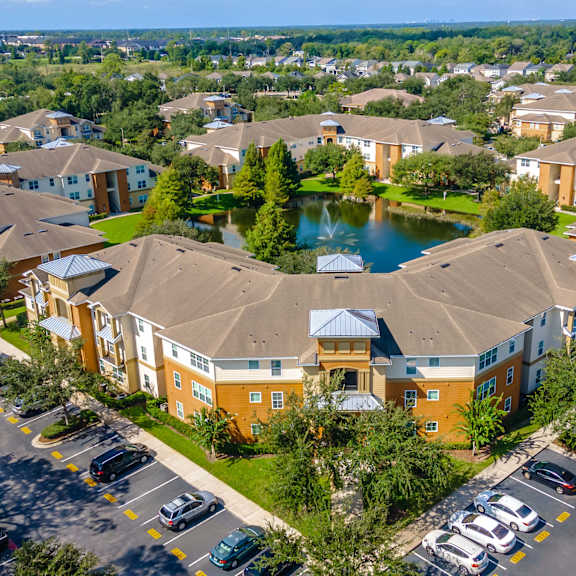 an aerial view of a community with houses and a lake