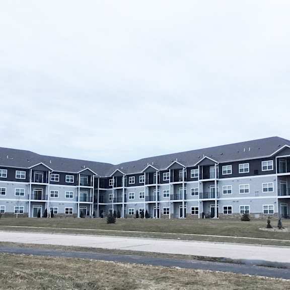 an apartment building on the side of a road
