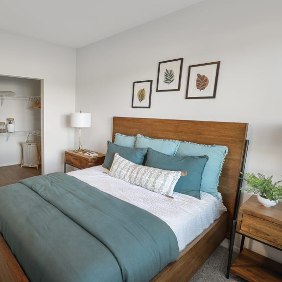 a bedroom with a large bed and closet