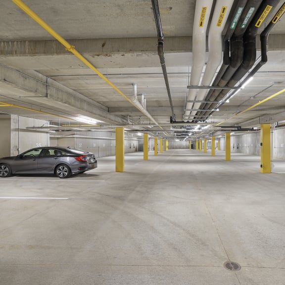 a car parked in an empty parking garage