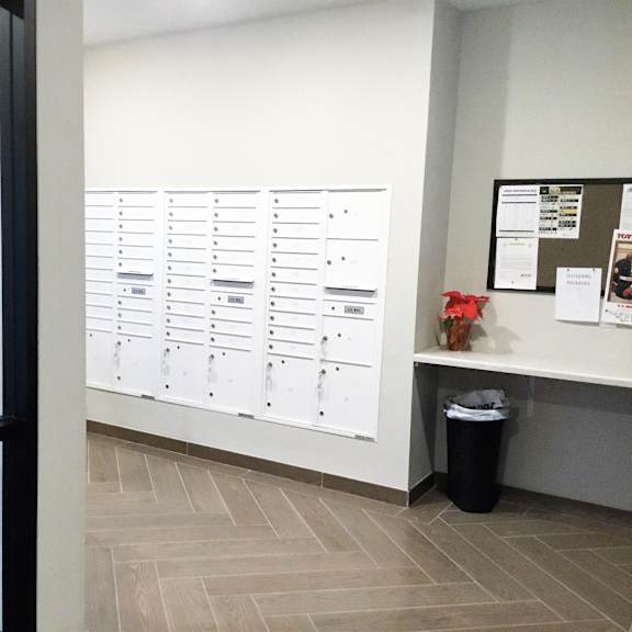 a view of the lockers in an office with a window