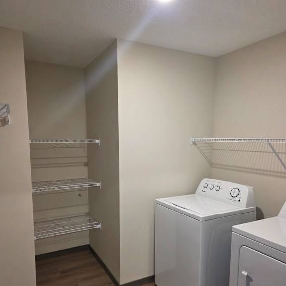 a closet with in-unit washer and dryer
