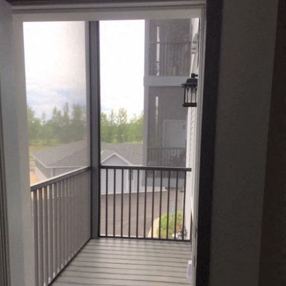 a view of a balcony from a door