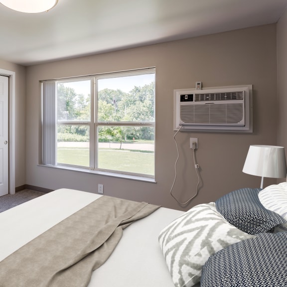 a bedroom with a bed and a window with an air conditioner