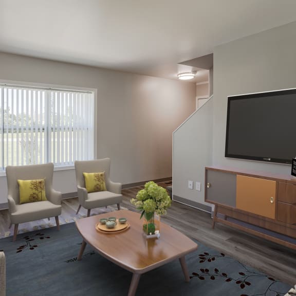 a living room with couches and chairs and a television