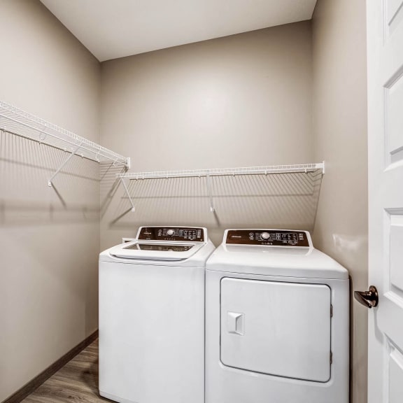 a laundry room with washer and dryer in it