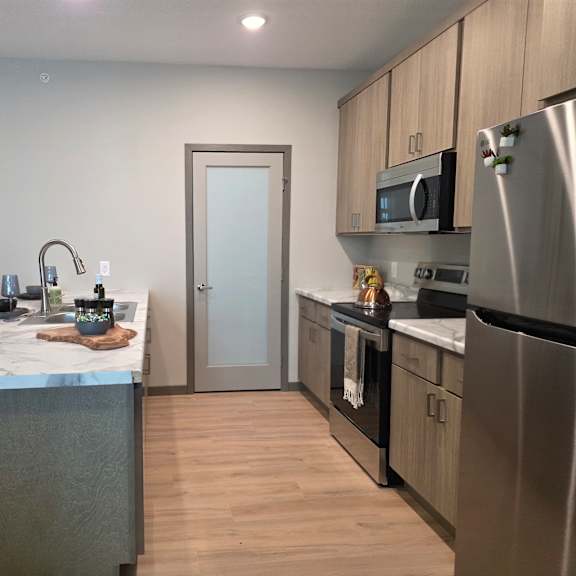 a kitchen with a table and chairs.