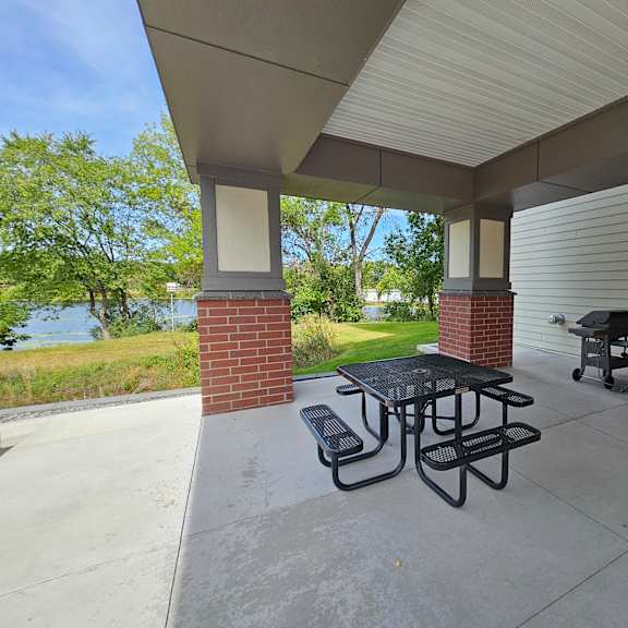 picnic table under a covered patio.