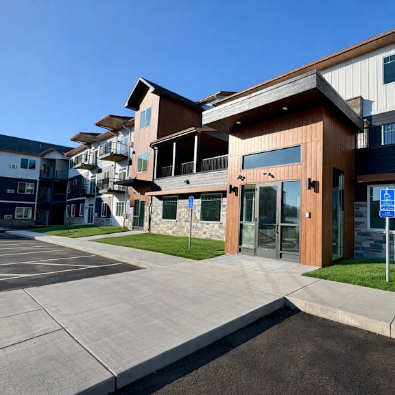 a building with a parking lot in front of it.