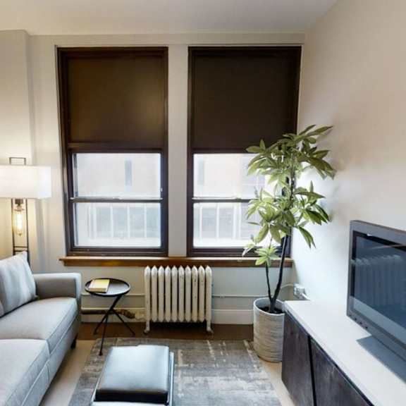 a living room with a couch and a television