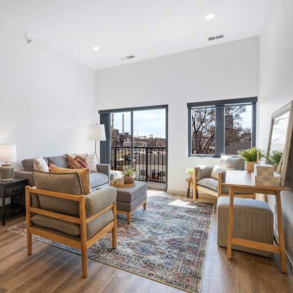 a well-lit, spacious living room with a view of the outdoors.