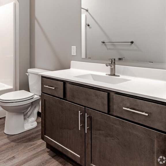 an image of a bathroom with a toilet and a sink