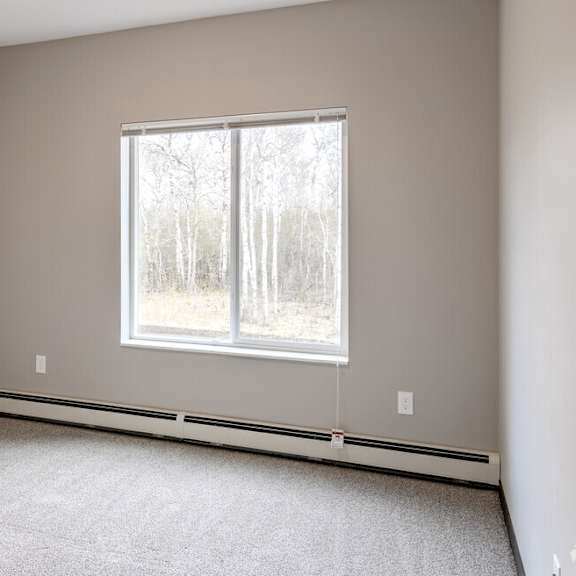 an empty room with a large window in it