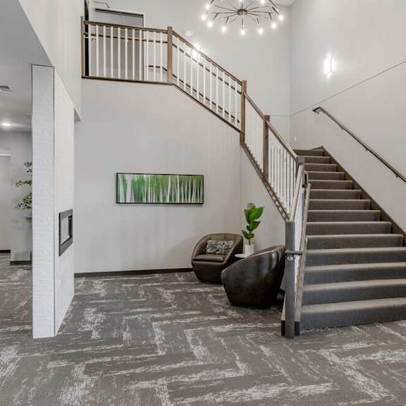 theoyer of a house with a staircase and carpeted stairs