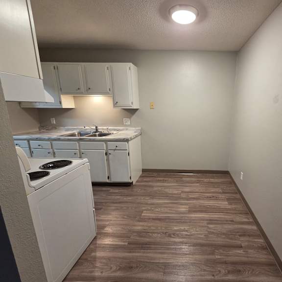 a small kitchen with a washer and dryer.