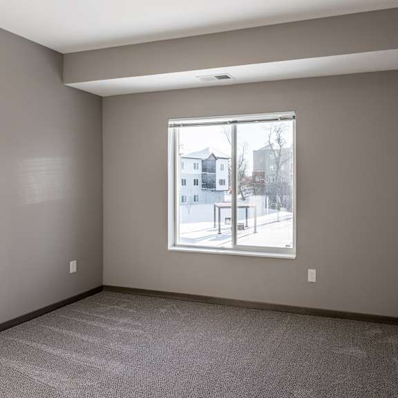 a room with a window showing a street view outside.