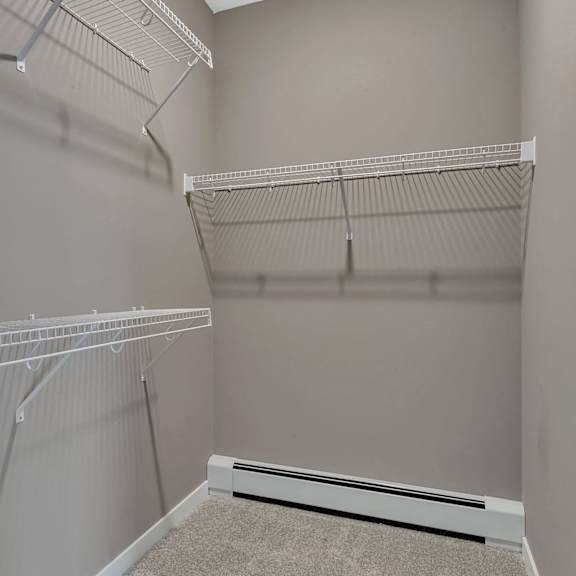 empty white shelves in a room.