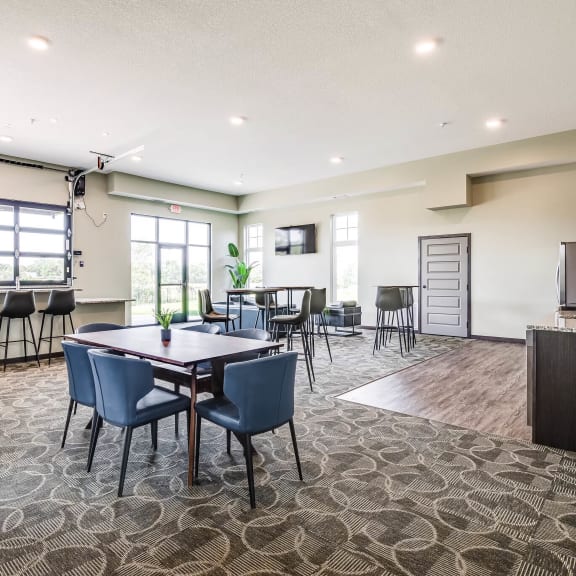 community room with a table and chairs