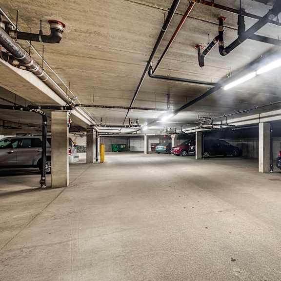 a parking garage with cars parked in it