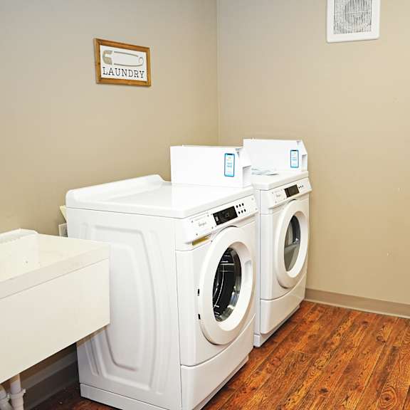 a laundry room with a washer and dryer.