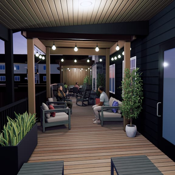 a group of people are sitting on a wooden deck.