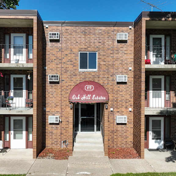 the image shows a brick building with the sign "chill estates" on the entrance.