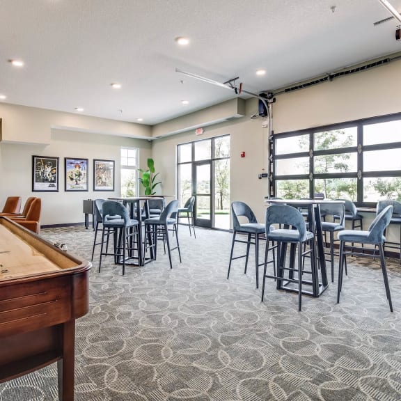 game room with a pool table and tables