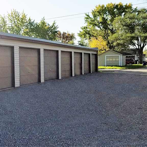 a long row of garage doors are closed.