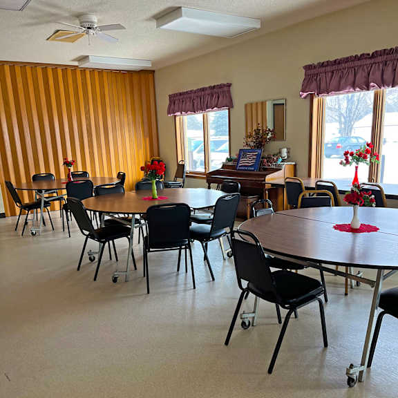 a dining room with tables and chairs