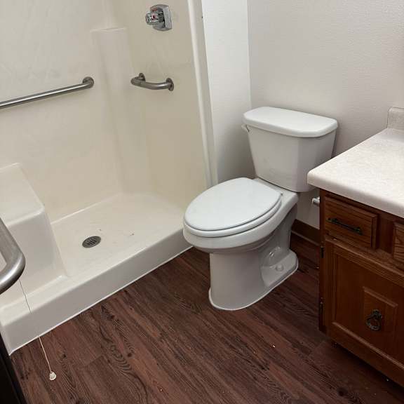 an overhead view of a bathroom with two toilets and a sink