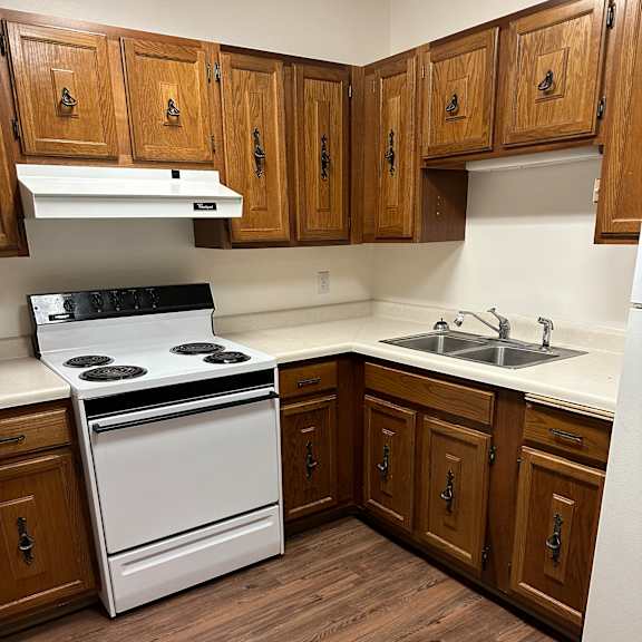 an overhead view of a kitchen with a stove and a refrigerator