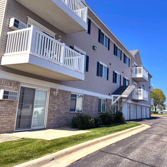 apartment building with a clear blue sky above.